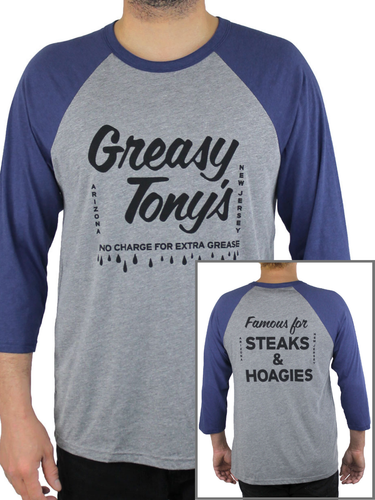 Man wearing raglan style t-shirt with 3/4 length sleeves. Sleeves are blue, body of shirt is heather gray and says Greasy Tony's No charge for extra grease. In the bottom right corner is an inset photo of the back of the shirt, that says Famous for Steaks and Hoagies.