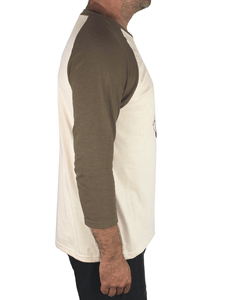 Side view of man wearing a Kaoru Betto baseball shirt, with olive green raglan sleeves, a beige body